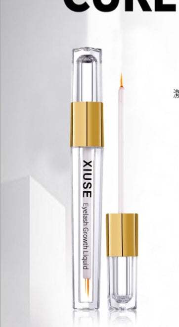 Eyelash growth liquid with golden cap, transparent body.