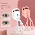 Portable electric heated eyelash curler for long-lasting curl, ergonomic design.