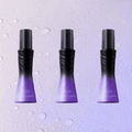 Three bottles of Leave-In Refreshing Voluminous Non-Sticky Hair Spray on a light purple background with water droplets - Vividbella