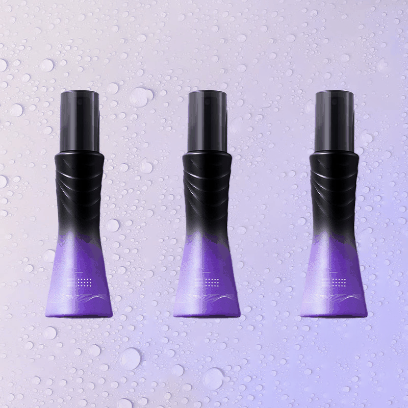 Three bottles of Leave-In Refreshing Voluminous Non-Sticky Hair Spray on a light purple background with water droplets - Vividbella