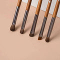 Shinedo horse hair eyeshadow makeup brush with wooden handle and dark brown aluminum ferrule.