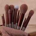 13 PCS green makeup brushes set including eye shadow and foundation brushes displayed on a soft background.