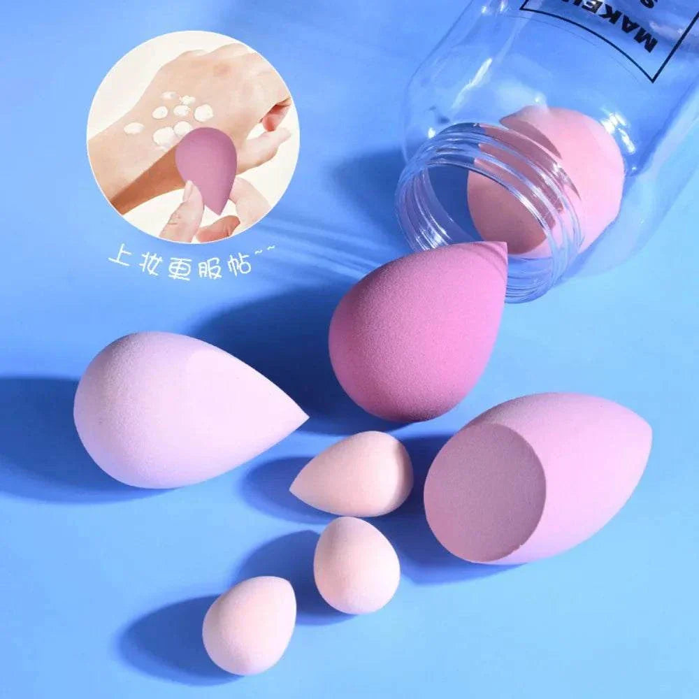 12/14 Piece Makeup Sponge Set with storage bottle, various pink cosmetic sponges on a light pink background.