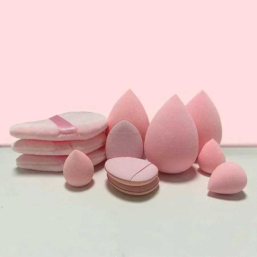 12/14 Piece Makeup Sponge Set with storage bottle, various pink cosmetic sponges on a light pink background.