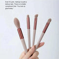 13pcs pink professional makeup brush set with soft fur, including brushes for eye shadow, foundation, blush, and more.