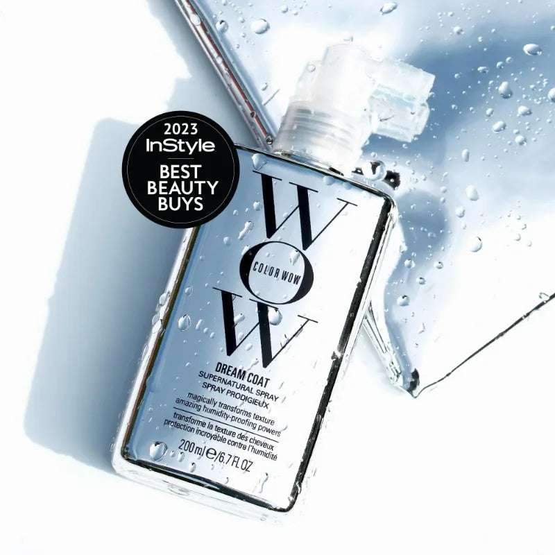 COLOR WOW Dream Coat anti-frizz hair mask spray bottle with water droplets, promoting glossy, smooth hair.