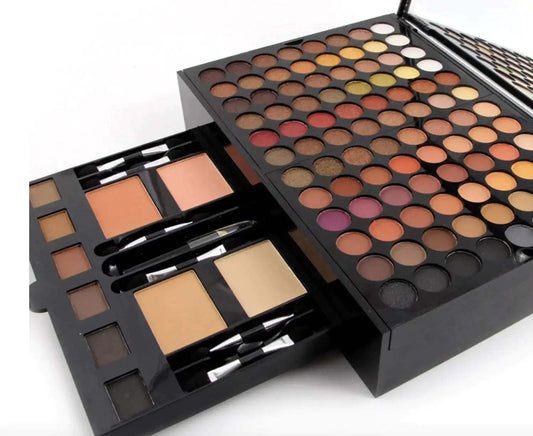 Ultimate Makeup Set featuring a variety of eyeshadows, blushes, and applicators.